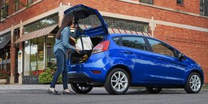 Woman packing a bag in a new 2019 Ford Fiesta | Ford Dealer | Houston, TX