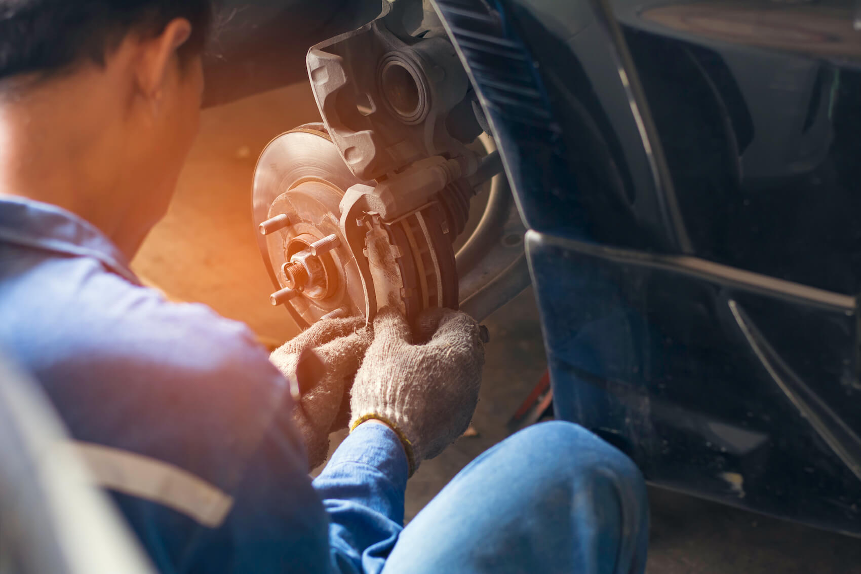 Technician Performing a Brake Inspection